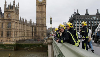 Emergency services members search for man in London