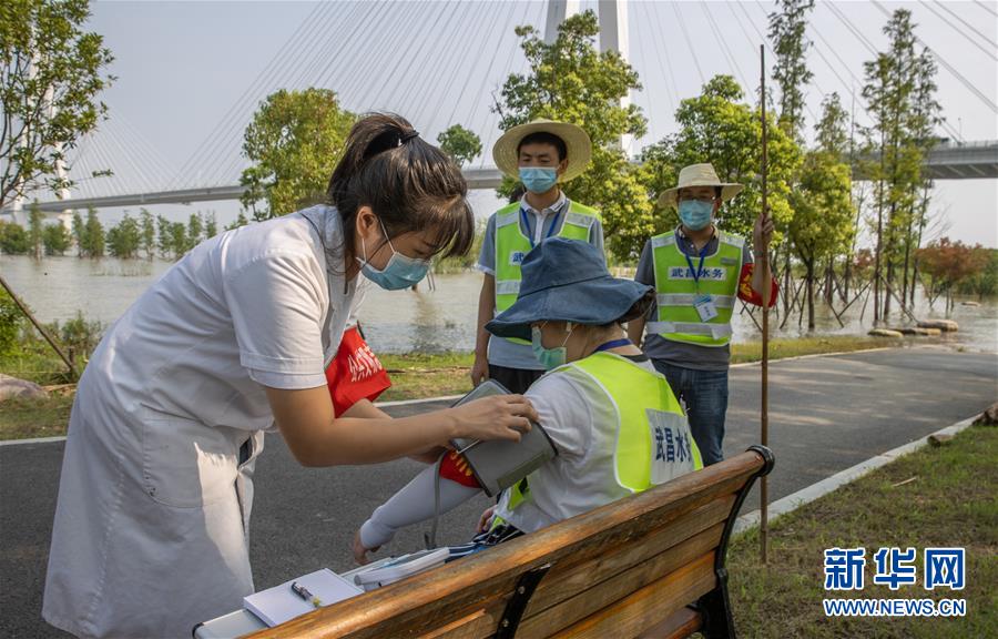 （在习近平新时代中国特色社会主义思想指引下——新时代新作为新篇章·习近平总书记关切事·图文互动）（8）战疫魔,斗洪魔——湖北全力应对防疫、防汛叠加“双考”